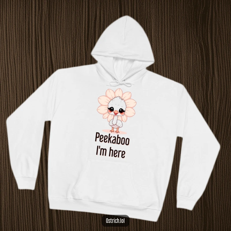 Funny baby ostrich peeking from behind a giant flower on a warm hoodie, a delightful and humorous wearable art piece.