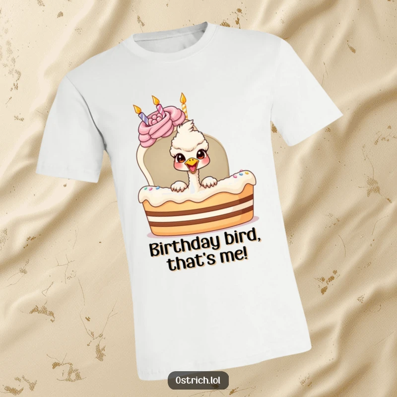 Funny ostrich character joyfully peeking out from a massive birthday cake on a t-shirt, a hilarious festive gift.